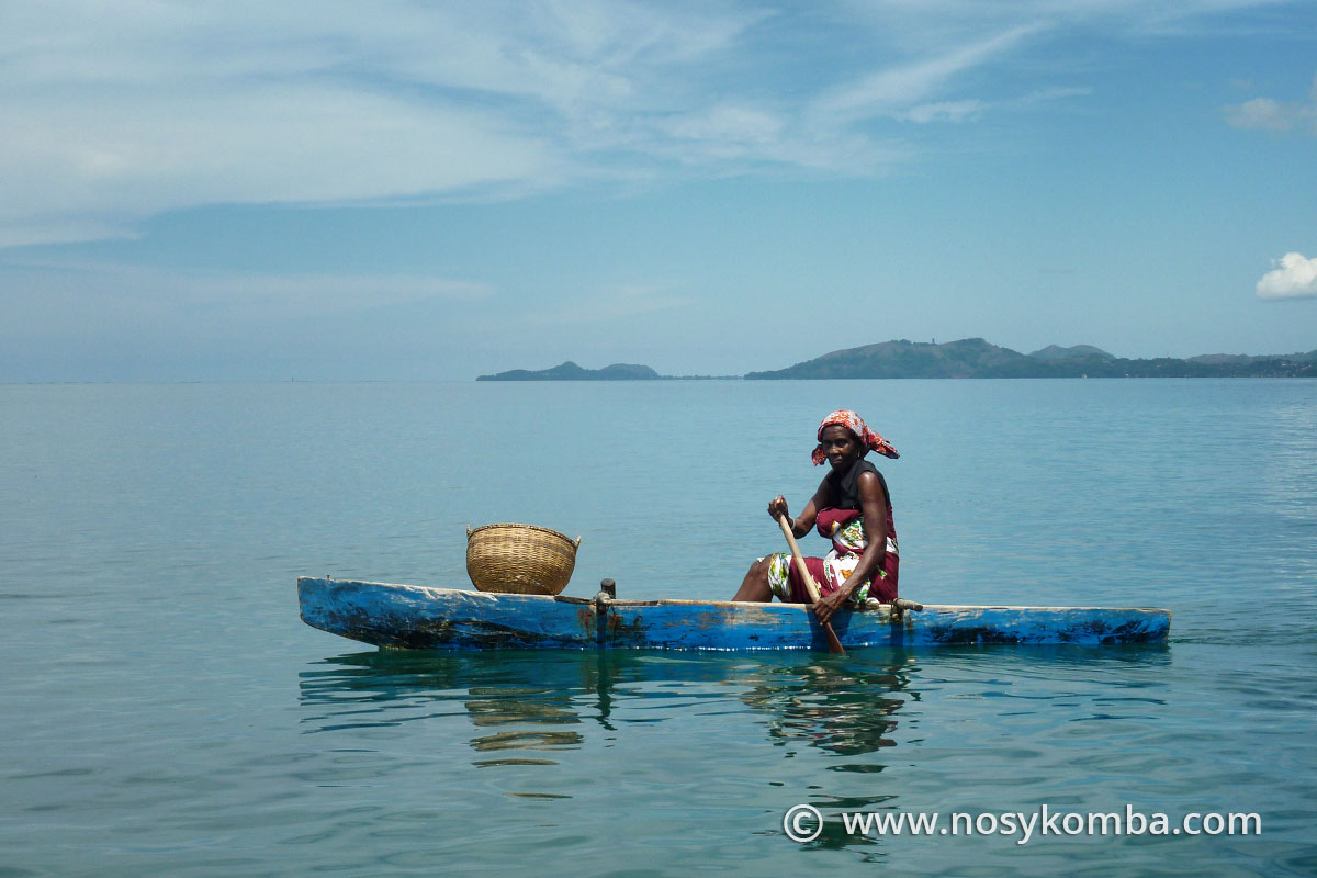Malagasy lady rowing a small pirogue
